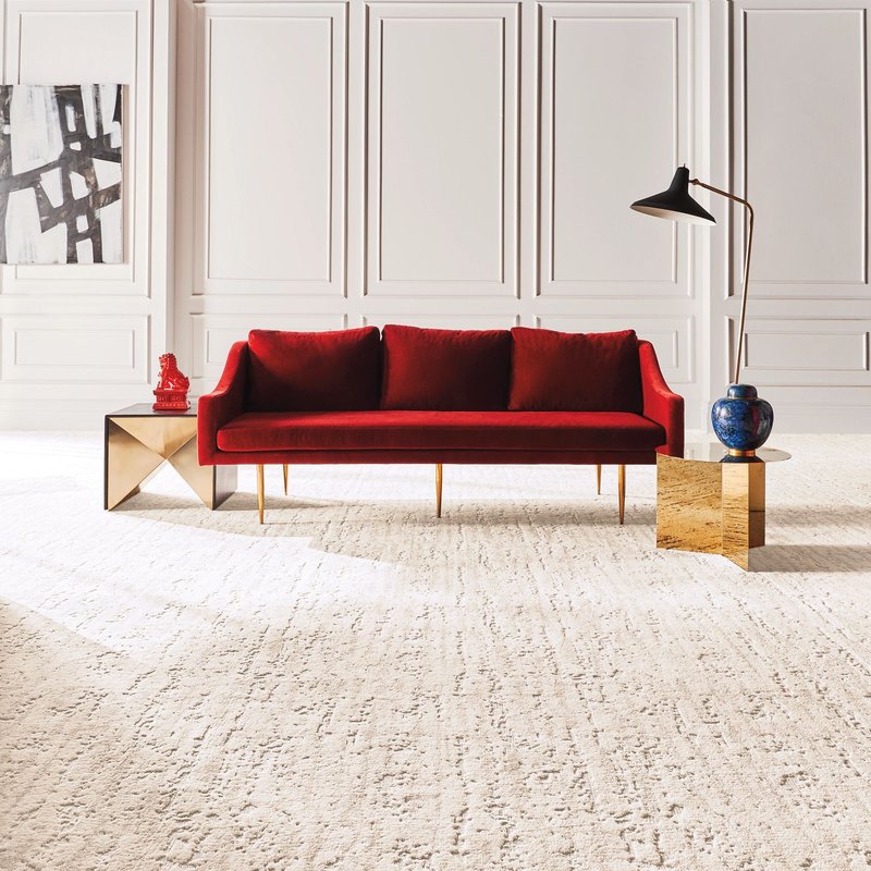 A red couch in the middle of the room from Home Floor Covering and Polson Stone and Tile in Polson, MT